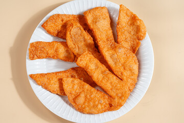 Pempek is a savoury Indonesian fishcake delicacy, made of fish and tapioca from Palembang. Pempek is served with sweet and sour sauce.