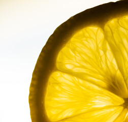 close up of lemon slices on white background