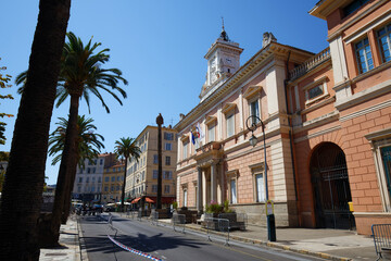 The city hall of Ajaccio framed by palm fronds. Ajaccio is the capital of South Corsica island, France.