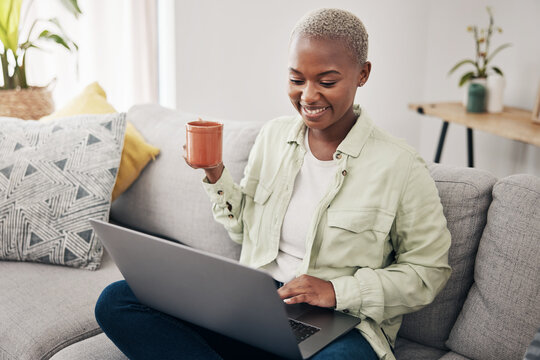 Home laptop, communication and happy black woman reading social network notification, online media or website search engine. Computer, lounge sofa and African person research, internet and drink tea