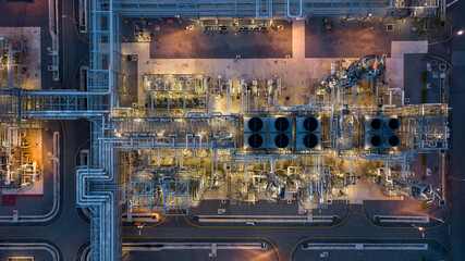 Aerial view power plant for oil refinery petrochemical industrial, Oil  refinery factory power plant at night and pipeline steel, Oil refinery factory and power plant. - obrazy, fototapety, plakaty