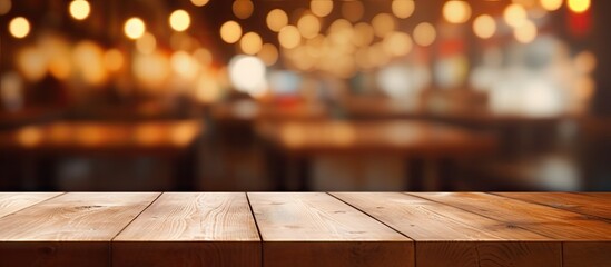 Choose a blank wooden table with a coffee shop backdrop for your photo editing or product showcasing