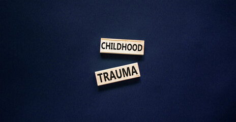 Childhood trauma symbol. Concept words Childhood trauma on beautiful wooden blocks. Beautiful black...