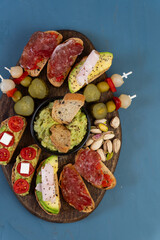 Sweet and savory snacks on a blue background.