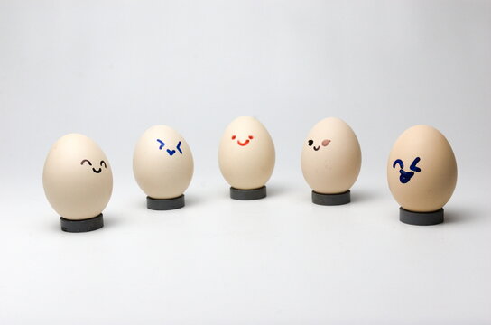 eggs with smile emotion on grey background