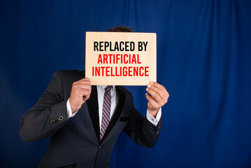Holding the sign about artificial intelligence replacing him from the job