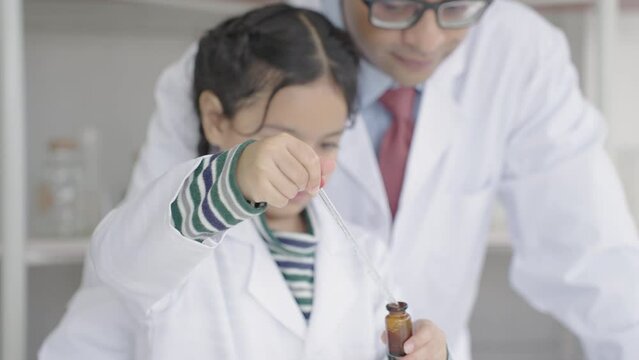 Indian students child and teachers in a science classroom