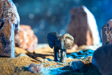 Elephant in a rocky gorge at night.