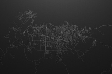 Street map of Malabo (Equatorial Guinea) on black paper with light coming from top