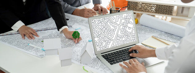 Worker, architect and engineer work on real estate construction project oratory planning with...