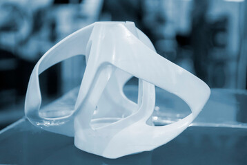 Printed models on 3D printer close-up. Objects printed on photopolymer sla 3D printer from liquid...
