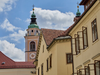 Fototapeta premium Bell tower of the Cathedral of Ljubljana with a clock. Church of St. Nicholas. Slovenia, Europe