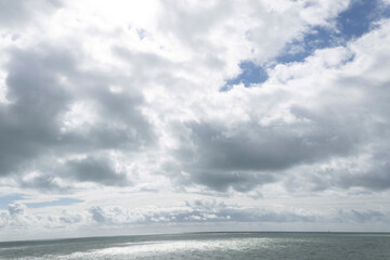 Beach cabins and seashore in Gouville sur Mer, Manche, Normandy, France in various lights