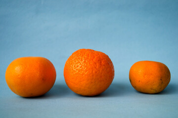 oranges on blue background for used in magazine cover or social media marketing concept