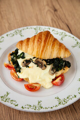 Croissant with spinach, champignon mushroom and cheese