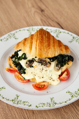 Croissant with spinach, champignon mushroom and cheese