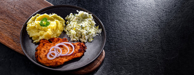 Chicken cutlet coated with breadcrumbs with potatoes and cabbage