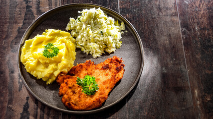 Chicken cutlet coated with breadcrumbs with potatoes and cabbage