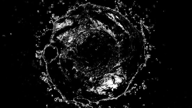 Super Slow Motion of Splashing Water Rotation Isolated on Black Background. Filmed on High Speed Cinema Camera, 1000 fps. Speed Ramp Effect.