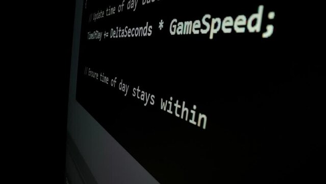 Closeup macro shot movement of coding script moving across LED screen with real-time AI-generated typing, showcasing advanced AI learning in optimization, debug and coding for software development.