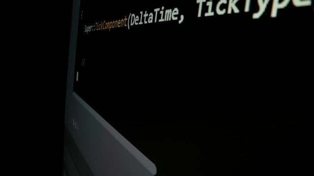 Closeup macro shot movement of coding script moving across LED screen with real-time AI-generated typing, showcasing advanced AI learning in optimization, debug and coding for software development.