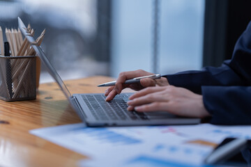 Fototapeta premium beautiful finger of Asian women used laptop working in the office.