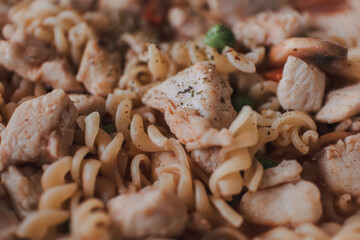 Homemade chicken breast pasta in a pan for high protein and diet recipe.