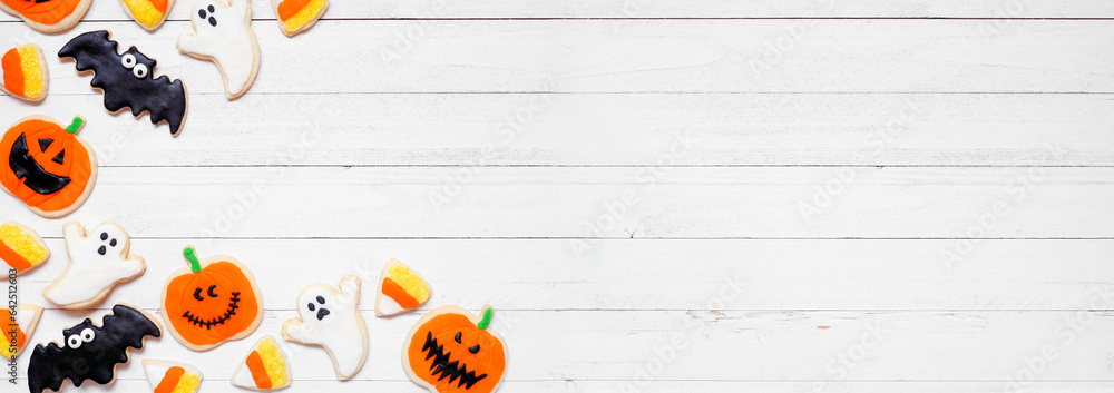 Poster halloween cookie corner border. above view on a white wood banner background with copy space. ghosts