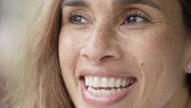 Close up portrait of attractive female talking to someone off camera