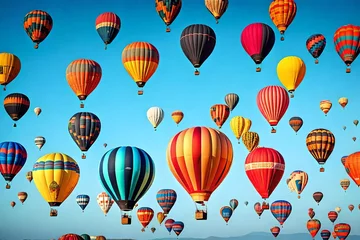 Papier Peint photo Montgolfière A colorful  air balloon festival against a clear blue sky