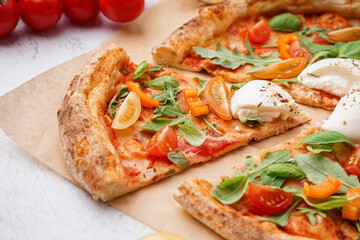 Tasty pizza with Burrata cheese on light background