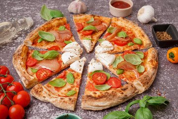Slices of tasty pizza with Burrata cheese on grey background