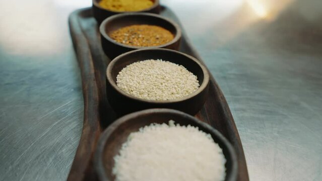 close-up of oriental spices standing on a metal counter in a professional kitchen in an Asian restaurant