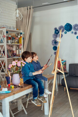 the concept of preschool education, painting, talent, happy family or parenting
