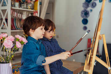 the concept of preschool education, painting, talent, happy family or parenting