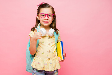 Happy elementary kid enjoying going to school