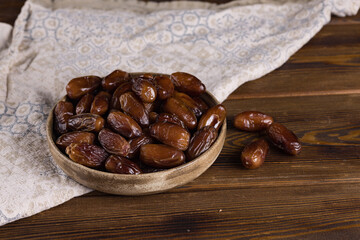 dates on a ceramic plate on a wooden table