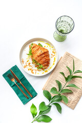 Croissant with cheese and vegetables in white plate. Top view on white table
