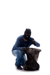 Young male burglar stealing money isolated on white