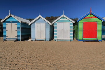 Fototapeta na wymiar Partial row of the 82 brightly painted Victorian bathing boxes on Dendy Street Beach, Brighton suburb. Melbourne-Australia-901