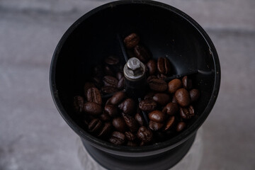 oversized kitchen type manual coffee grinder on gray background
