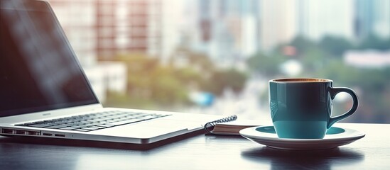 Office table with keyboard and coffee cup