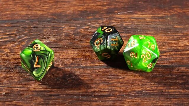 RPG dice, RPG game dice falling in super slow motian over rough surface, selective focus.
