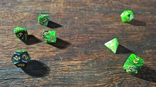 RPG dice, RPG game dice falling in super slow motian over rough surface, selective focus.