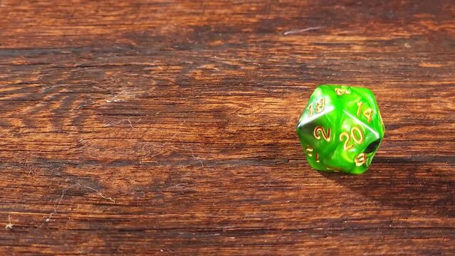 RPG dice, RPG game dice falling in super slow motian over rough surface, selective focus.