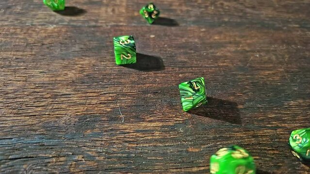 RPG dice, RPG game dice falling in super slow motian over rough surface, selective focus.