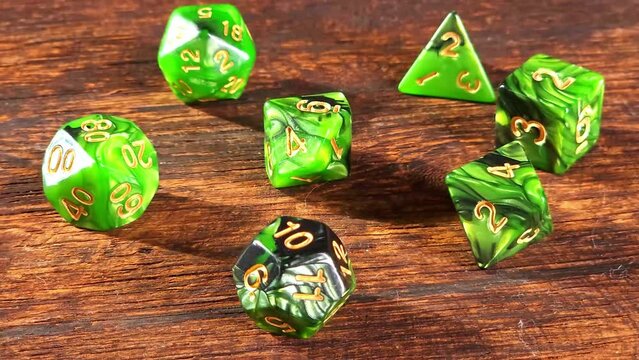 RPG dice, RPG game dice falling in super slow motian over rough surface, selective focus.