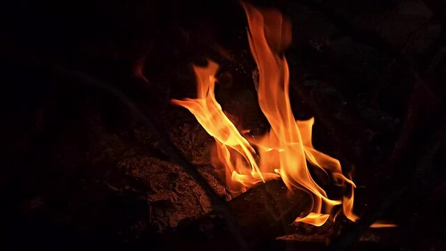 Fire in slow motion, fire flares seen in slow motion up close, natural light, 4k.