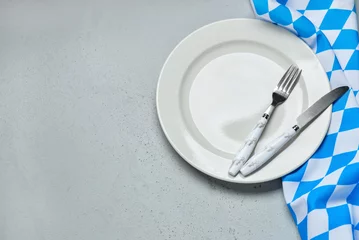 Foto op Aluminium Empty plate, fork, knife and blue checkered tablecloth on grey table © Pixel-Shot