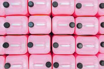 lot of Professional Liquid Wash Soap Refill light pink color chemicals in plastic bottles cans in the warehouse store. Heap Antibacterial Hand Soap in plastic canisters with white plastic cork cap.